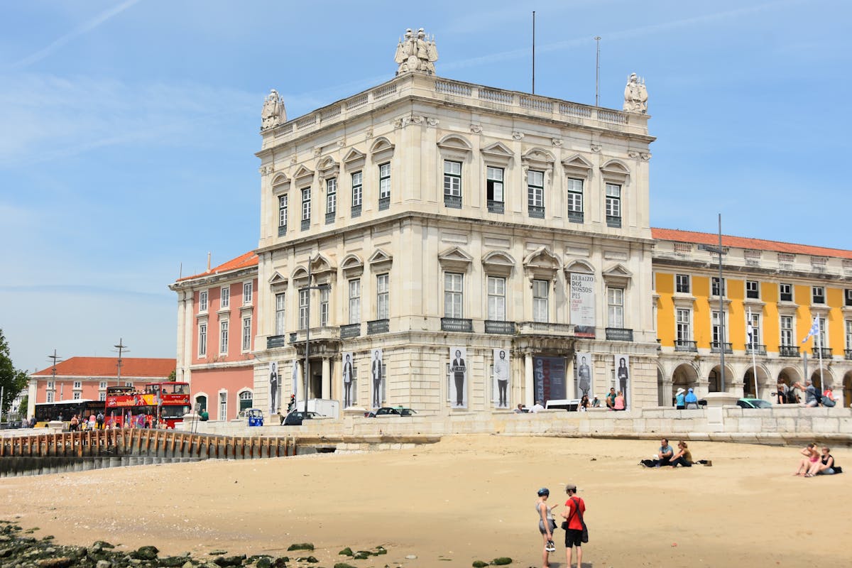 Praça do Comércio waterfront in Lisbon with historic yellow buildings