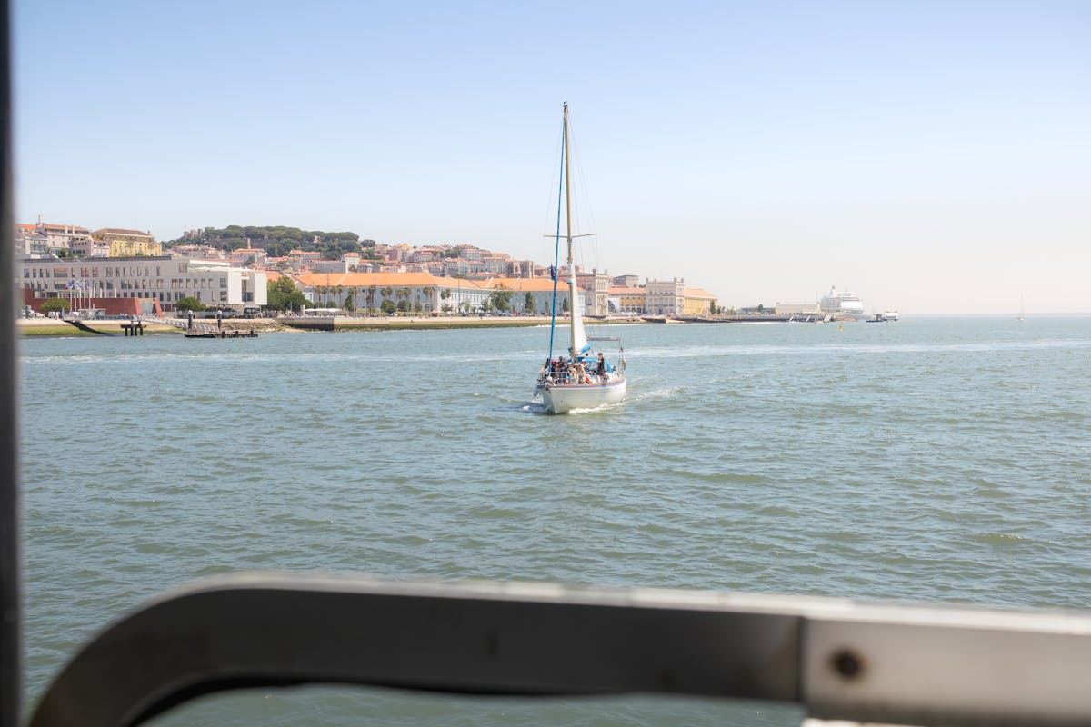 Tourists on a sailing tour along Lisbon's waterfront