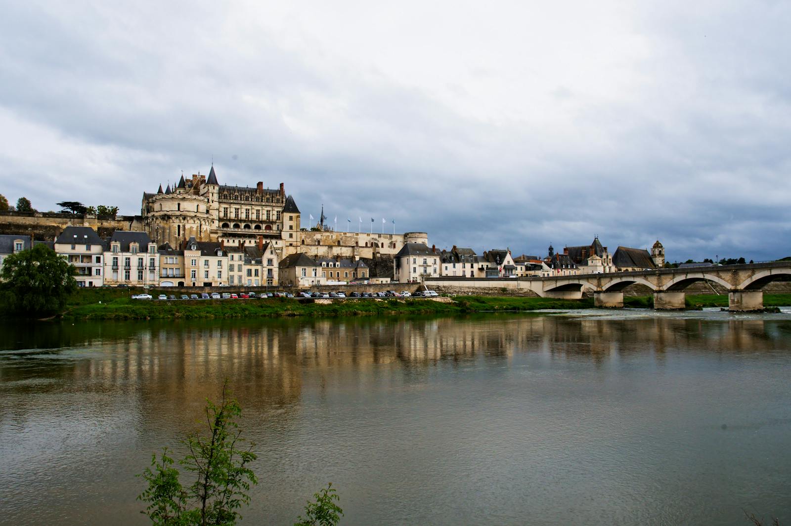 Chateau d Amboise and historic bridge over the Loire River in black and white