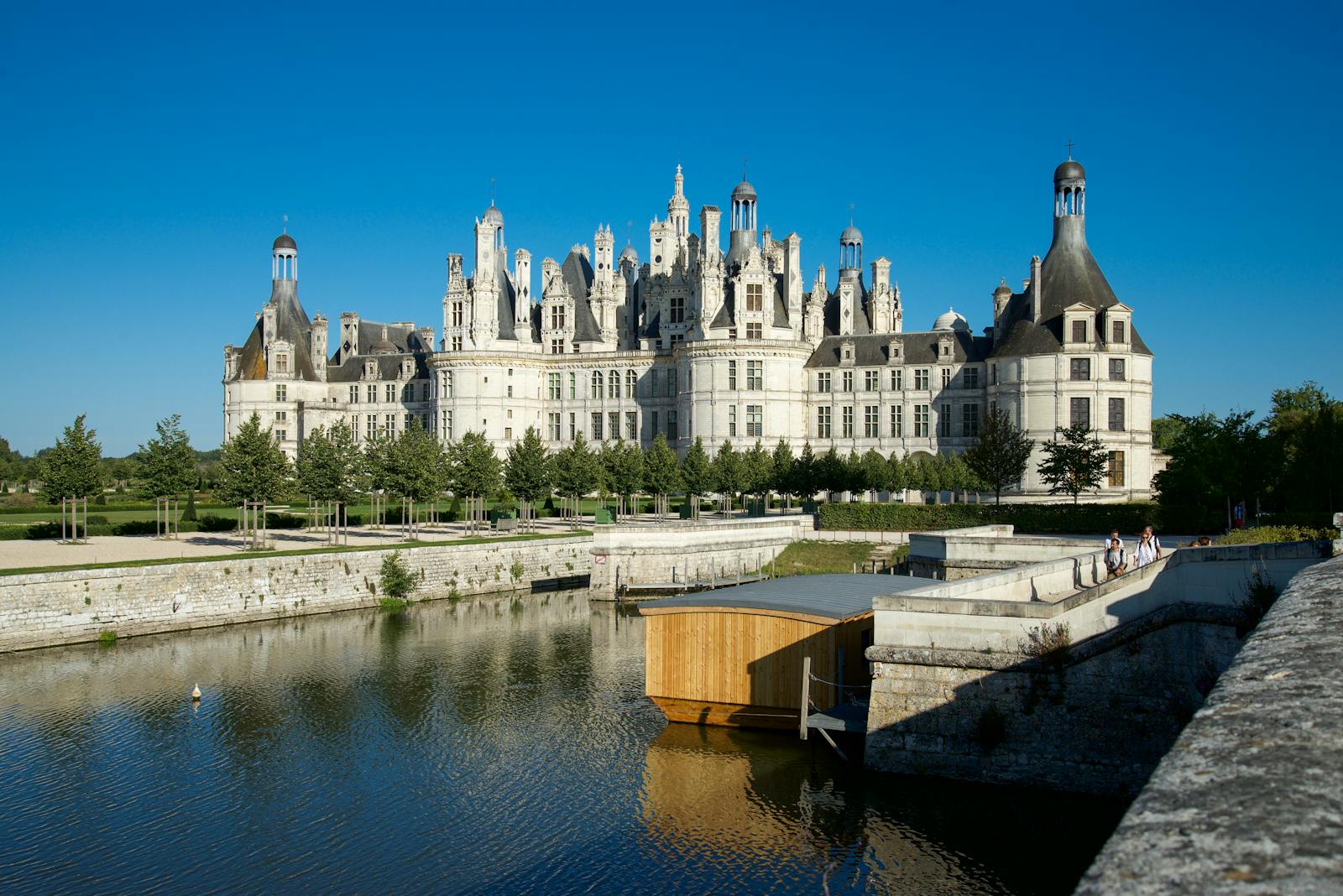 Chateau de Chambord surrounded by a peaceful summer landscape in the Loire Valley
