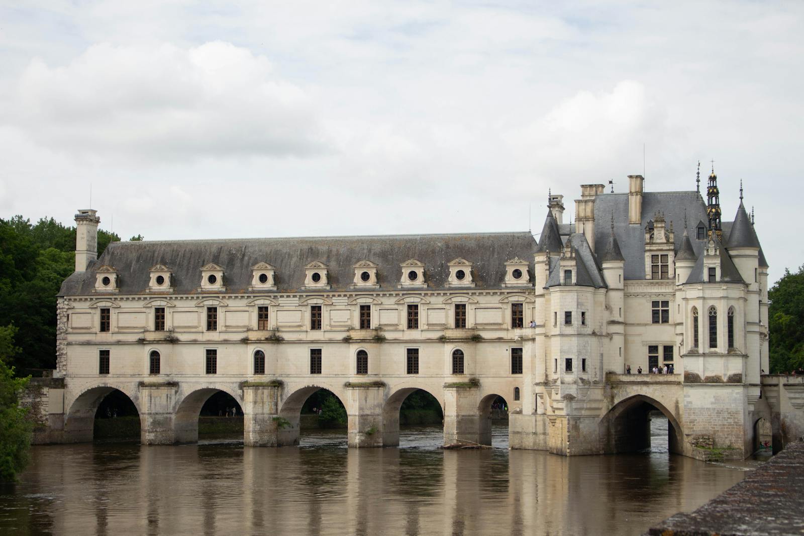 Chateau de Chenonceau spanning the tranquil Cher River showcasing Renaissance architecture