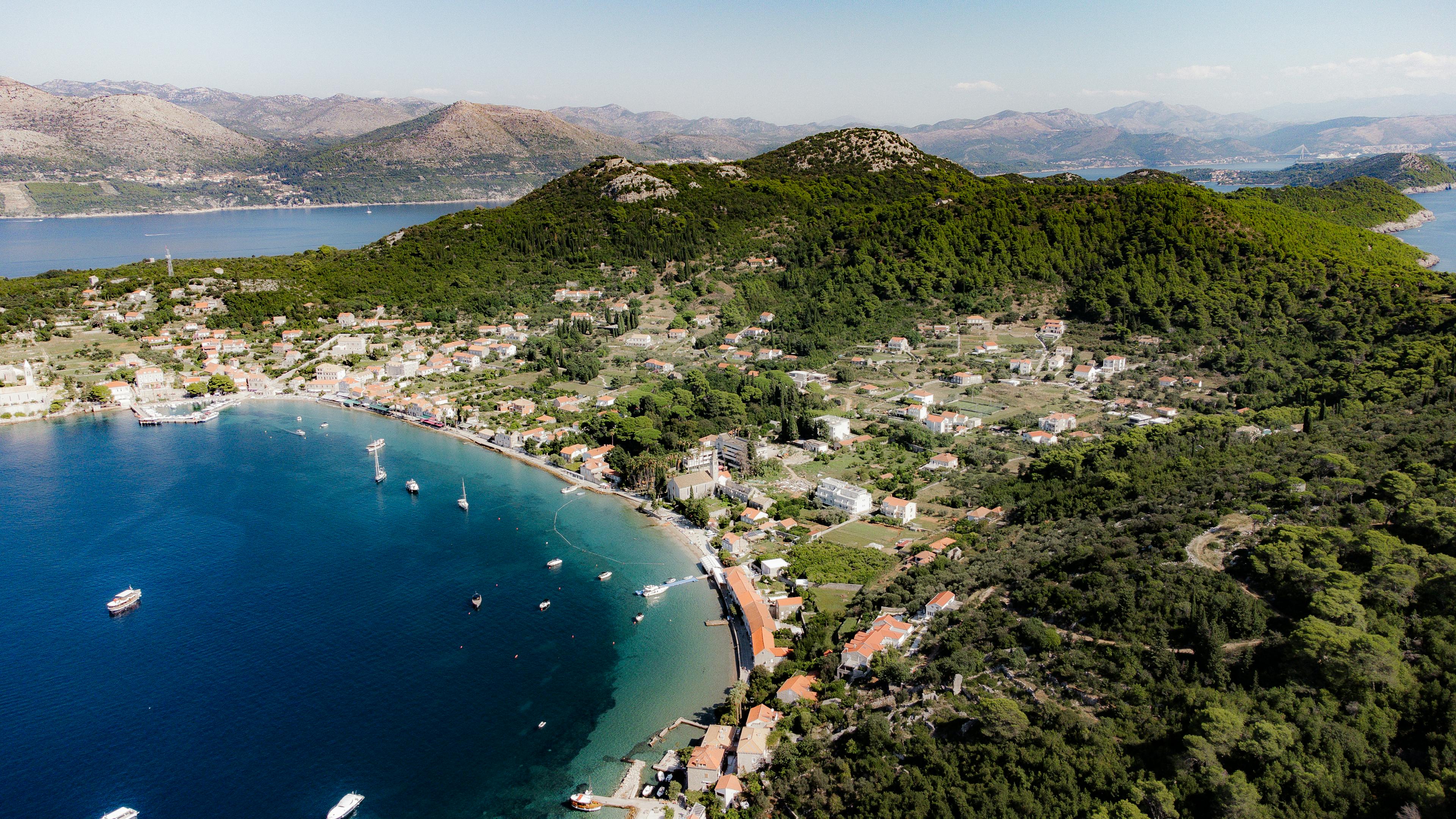 Stunning aerial view of Lopud Island's coastline, showcasing the Adriatic Sea and lush landscape