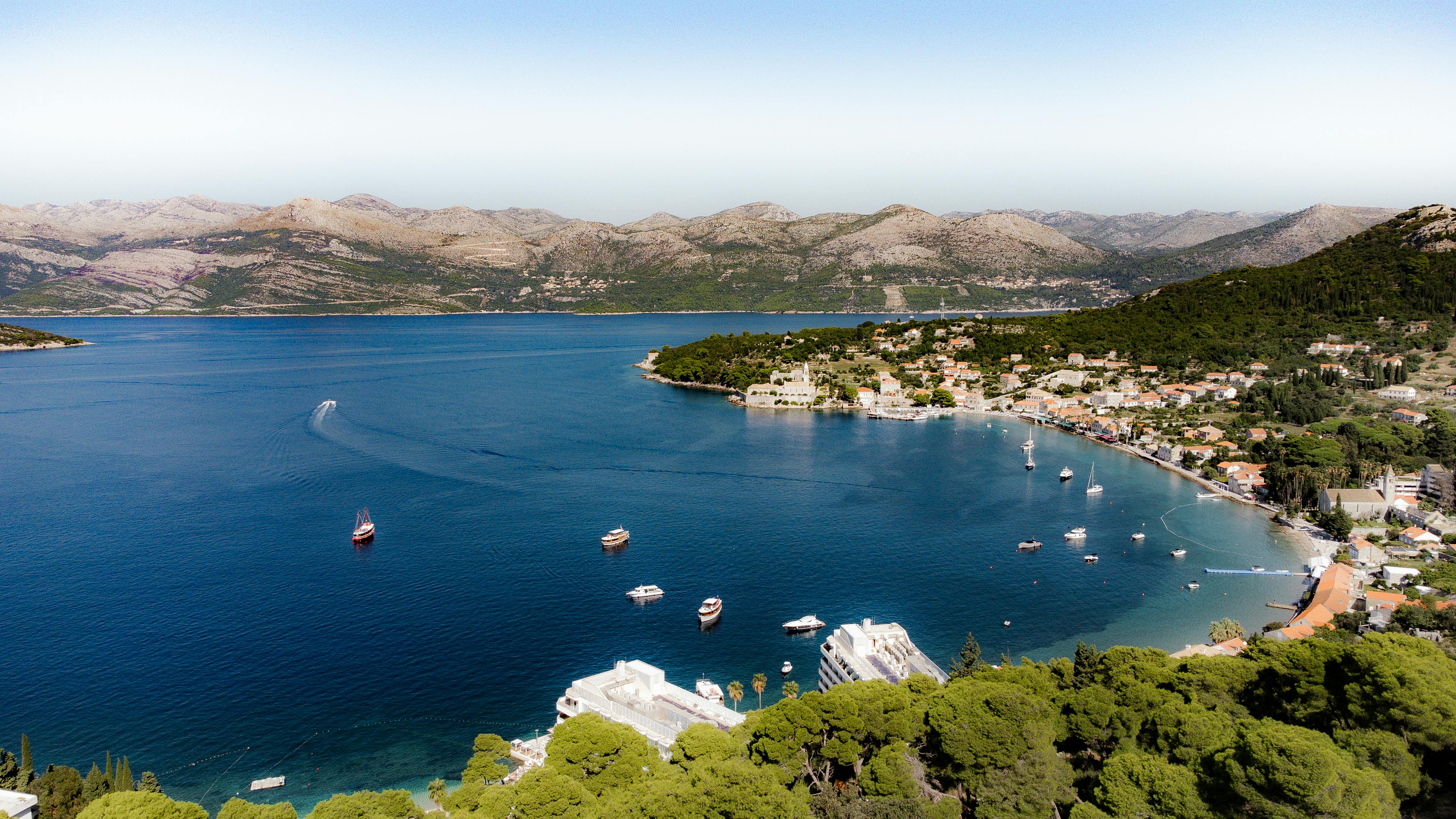 A breathtaking aerial shot of Lopud Island in Croatia, showcasing its stunning coastline and clear blue waters