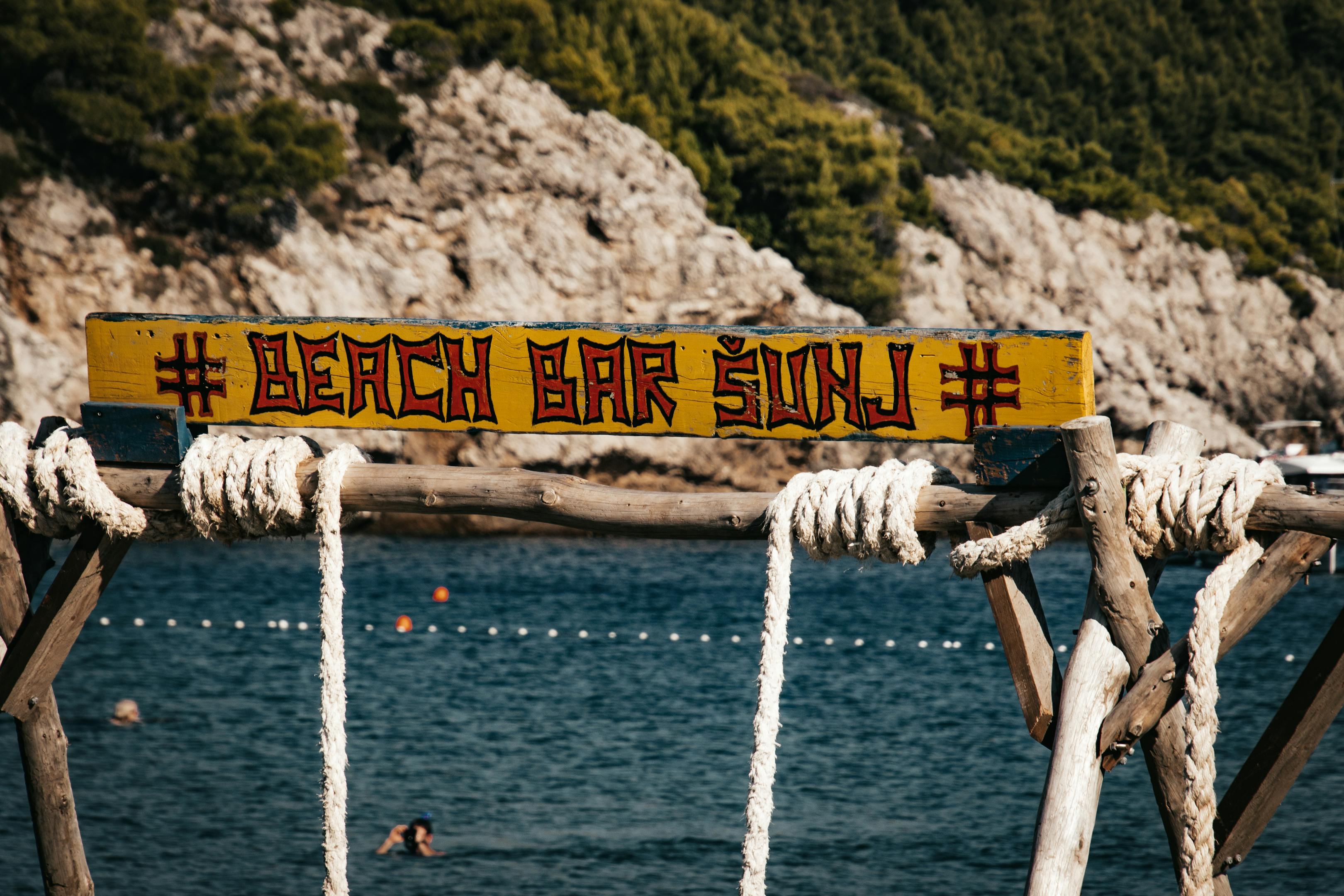 Relax at the iconic Beach Bar on Sunj Beach, Lopud Island, Croatia in a serene coastal setting