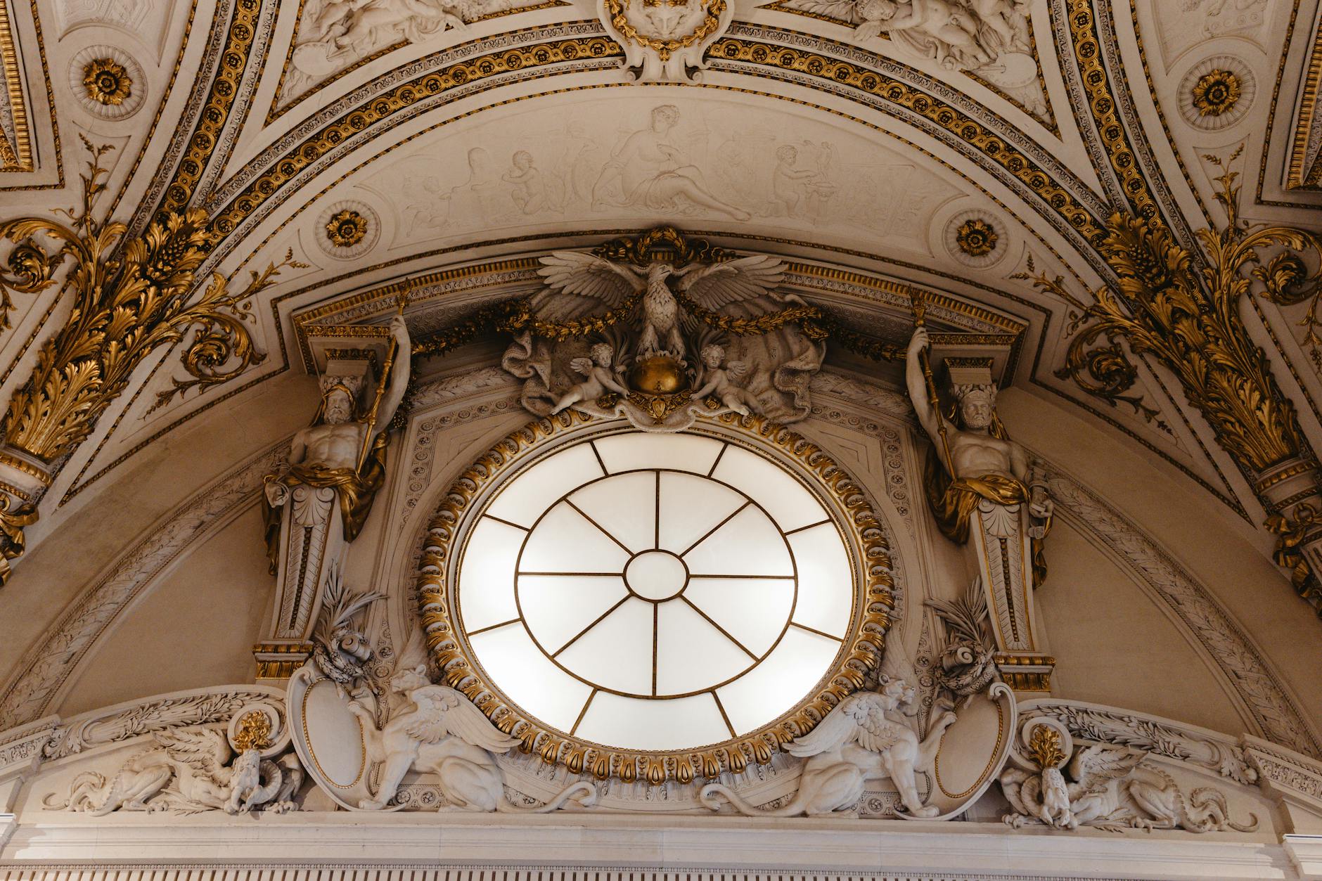Baroque architecture with an ornate sculpture at the Louvre