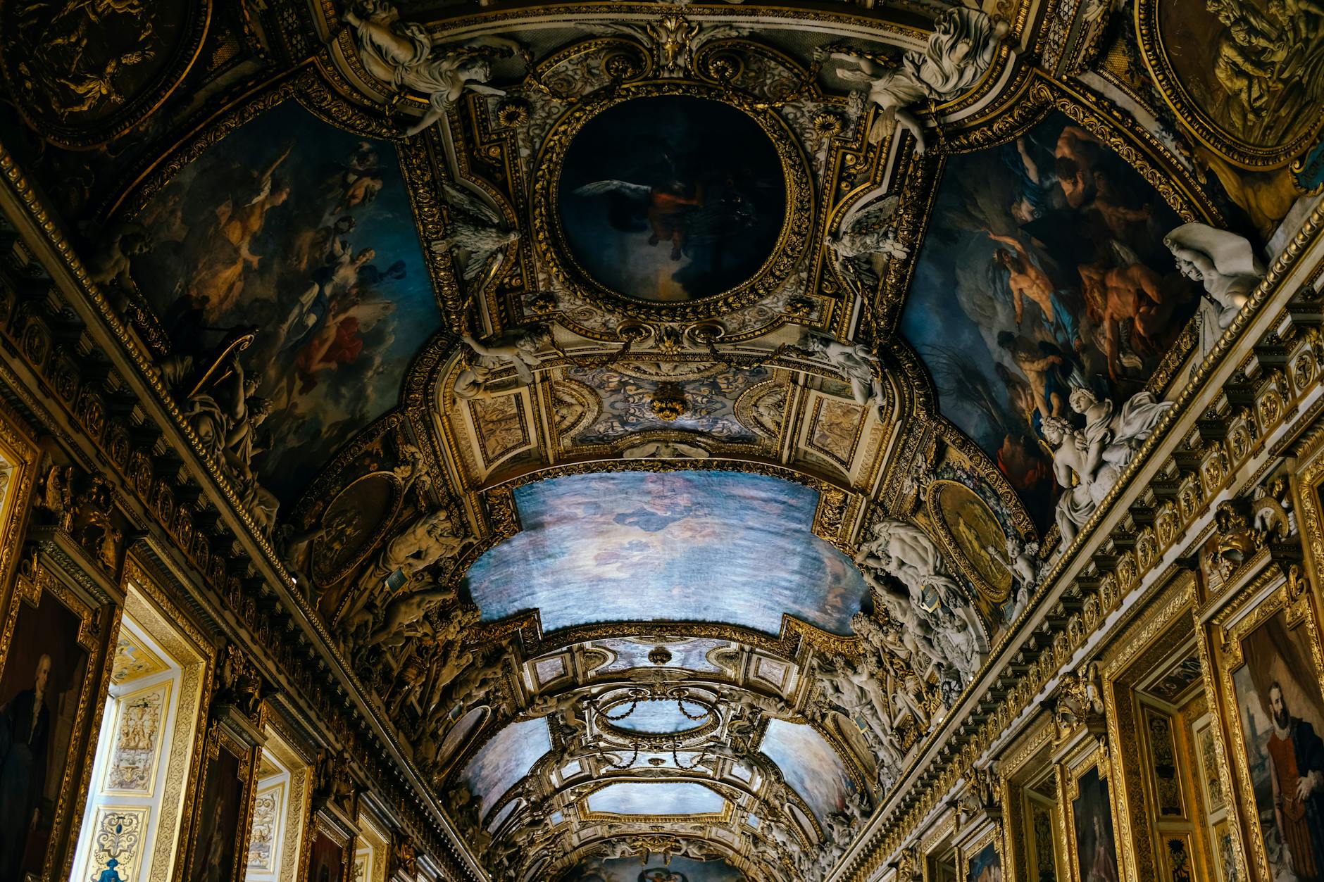 An ornate Baroque ceiling in the Louvre in Paris