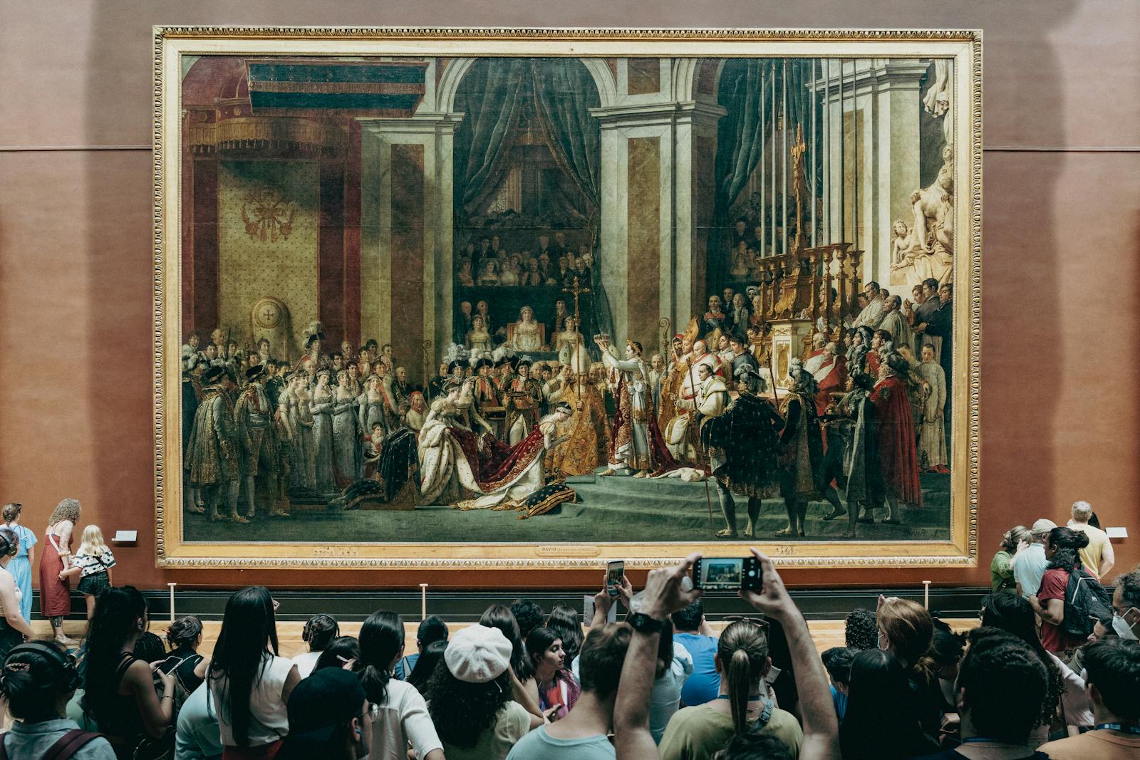 The Coronation of Napoleon painting in a gallery at the Louvre