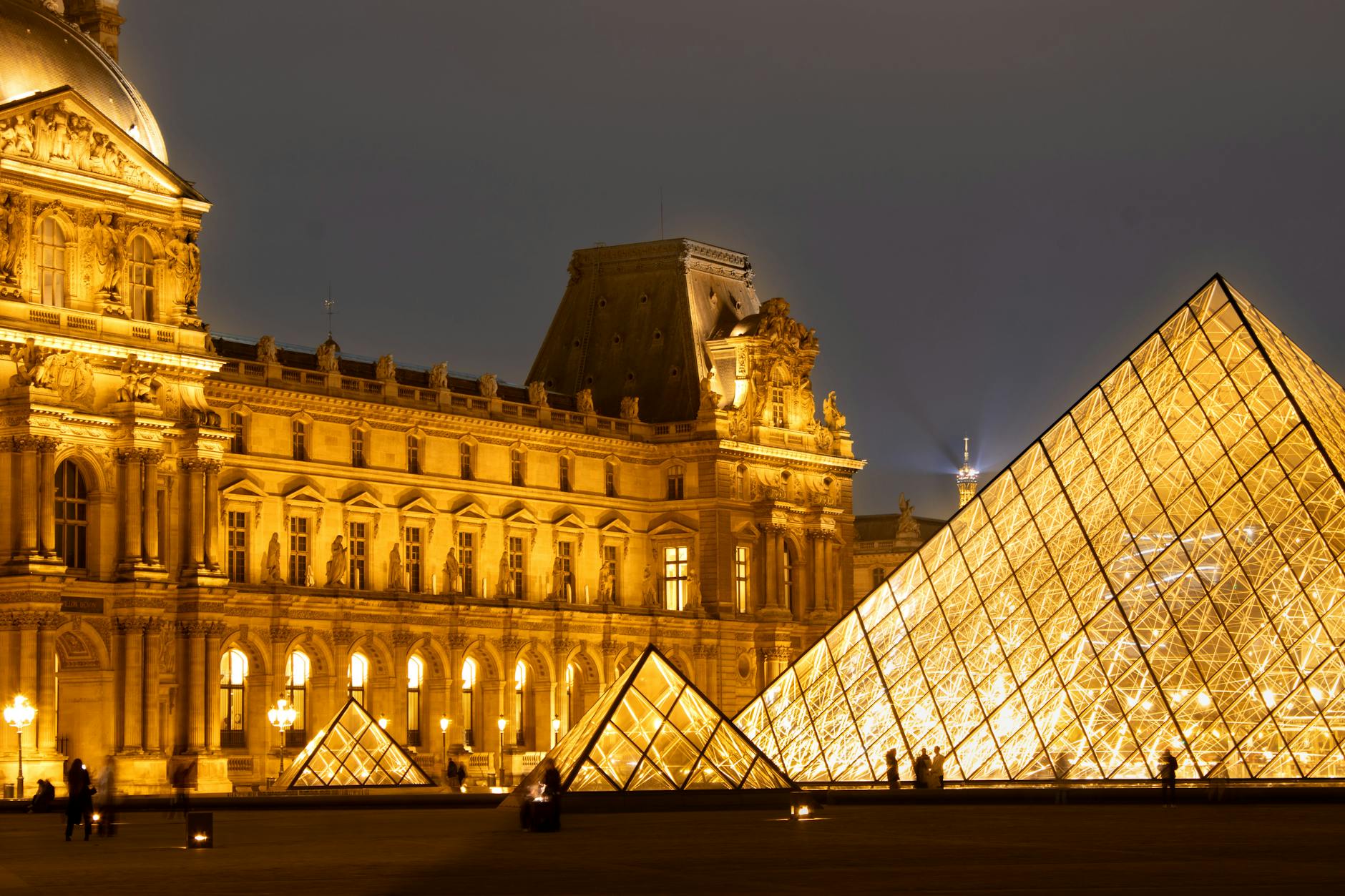 A night view of the Louvre Pyramid and the museum