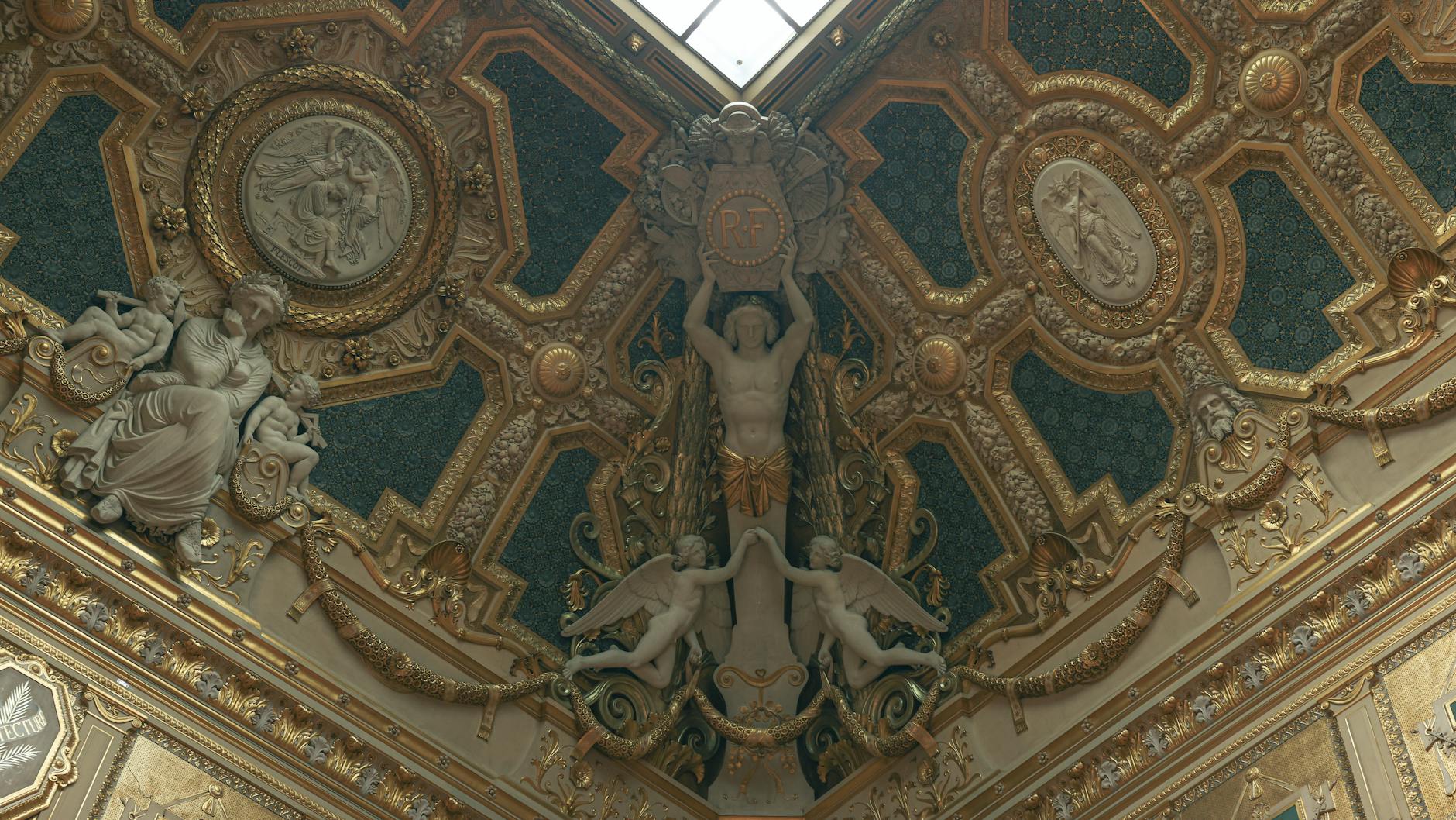 A sculpted ceiling with classical art in the Louvre