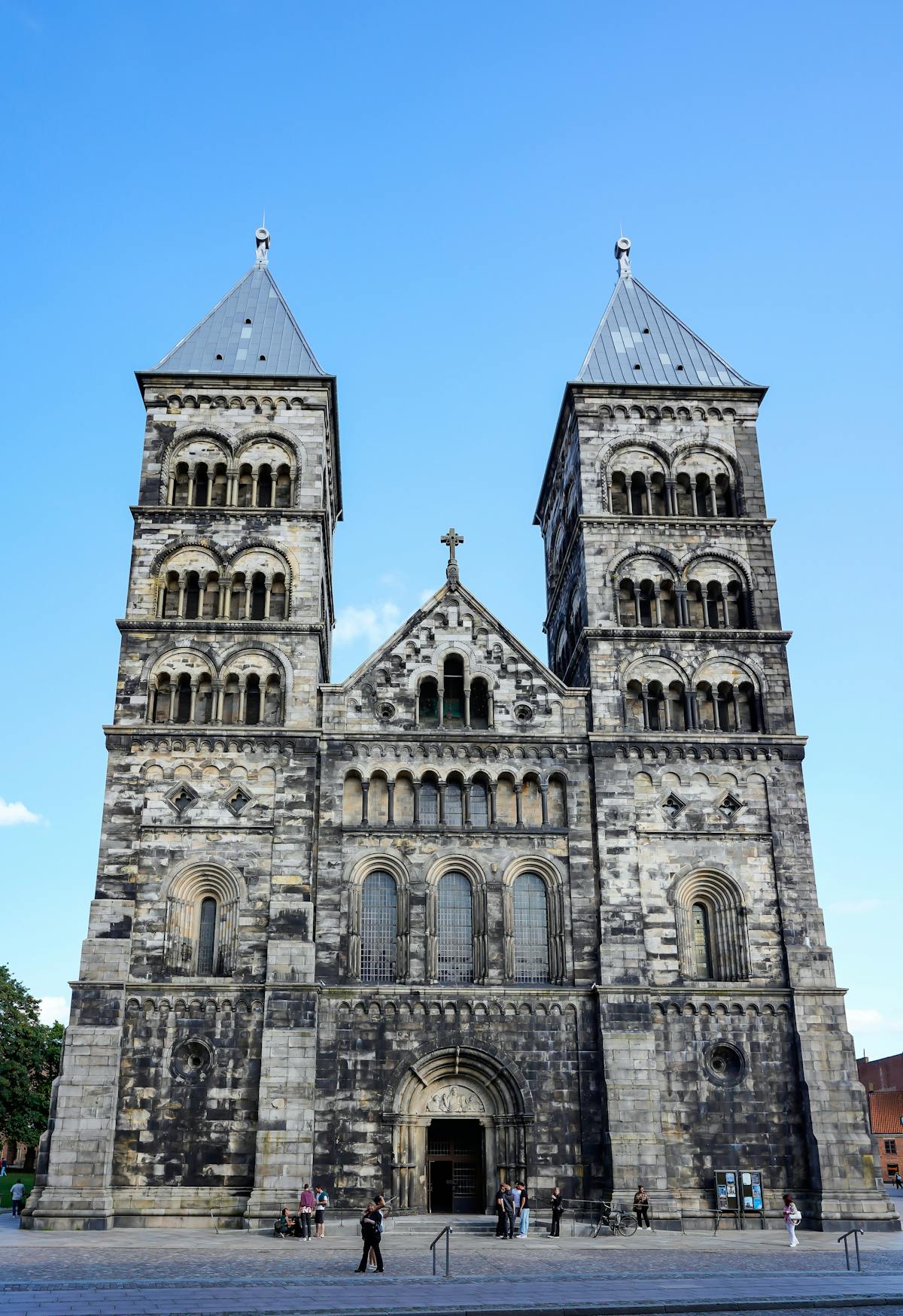 Front view of Lund Cathedral under clear blue sky in Sweden