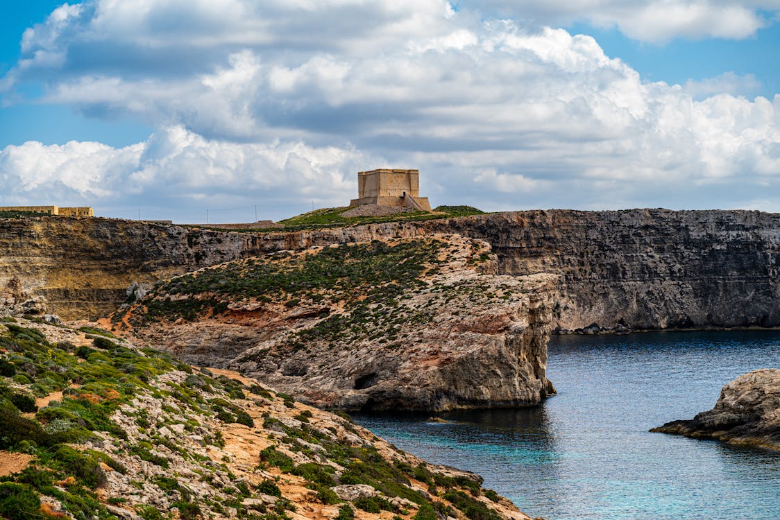 Malta cliffs and Fort St Mary on Comino island