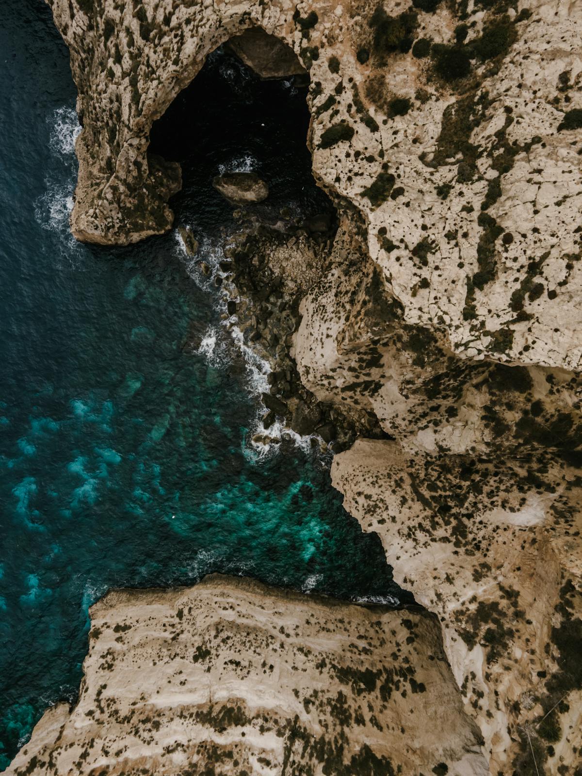 Aerial view of Malta's dramatic coastal cliffs and turquoise waters