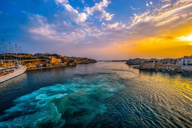 Malta Valletta harbour at sunset with boats