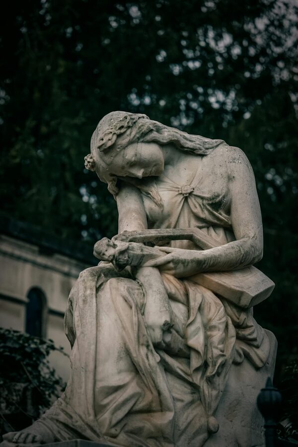 Marble female figure statue in Pere Lachaise Cemetery Paris