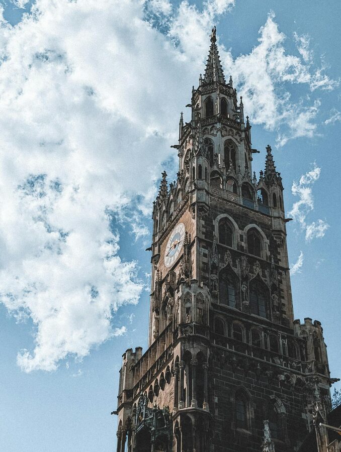 Marienplatz Glockenspiel tower against blue sky