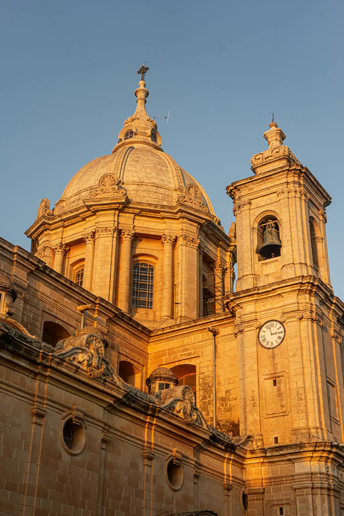 St. Paul's Cathedral in Mdina at golden hour with warm sunlight