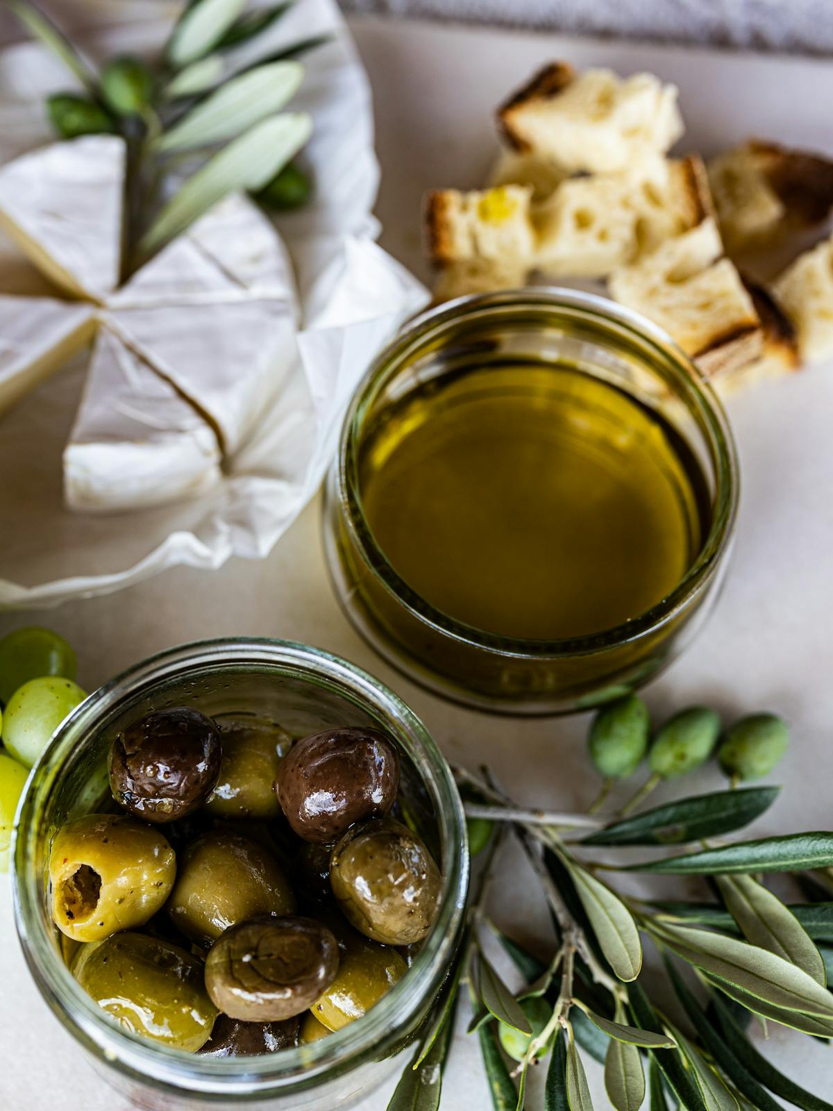 Mediterranean spread of olives, cheese, and bread with olive oil