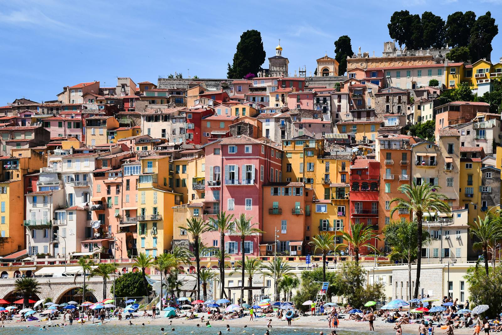 Colorful hillside houses in Menton by the beach on the French Riviera
