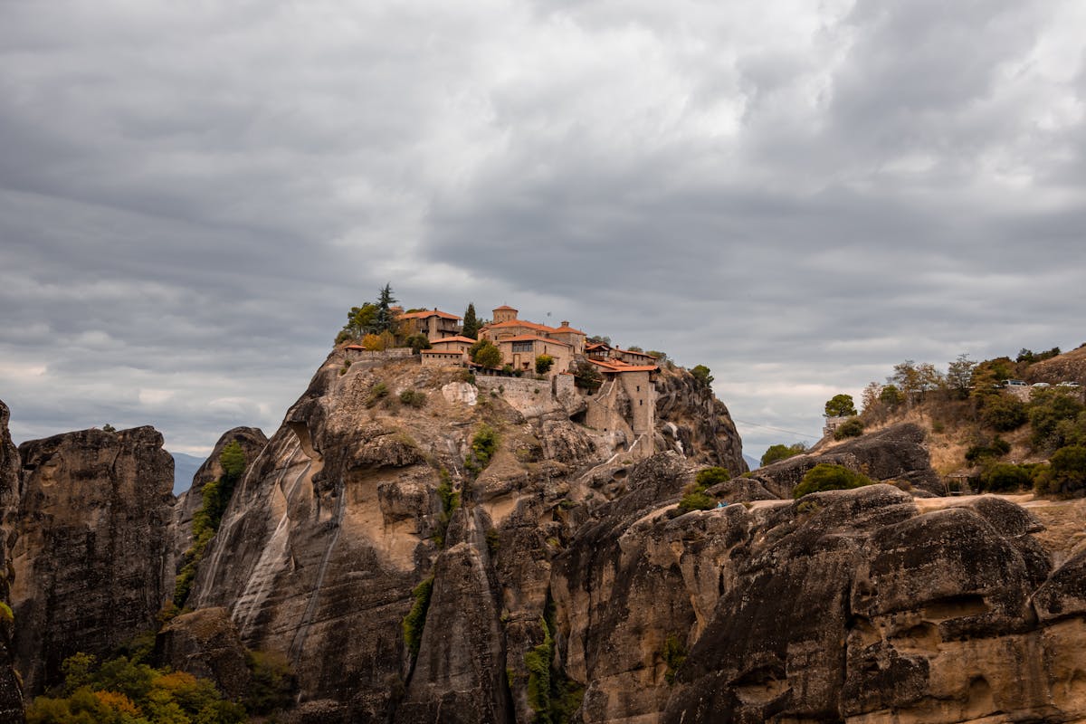 Dramatic landscape of Meteora monasteries under cloudy skies