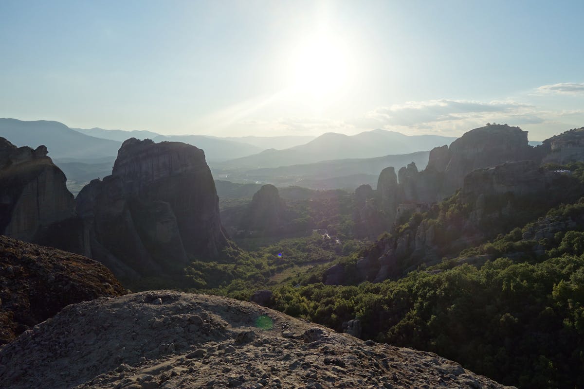 Meteora rock formations and monastery at sunset