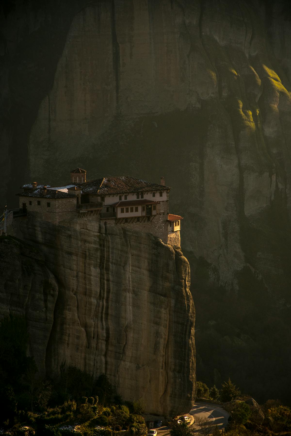 Monastery of Rousanou perched on a cliff at sunset