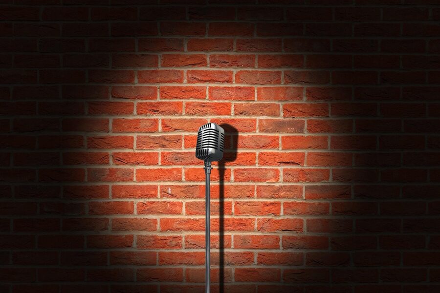 Vintage microphone against brick wall