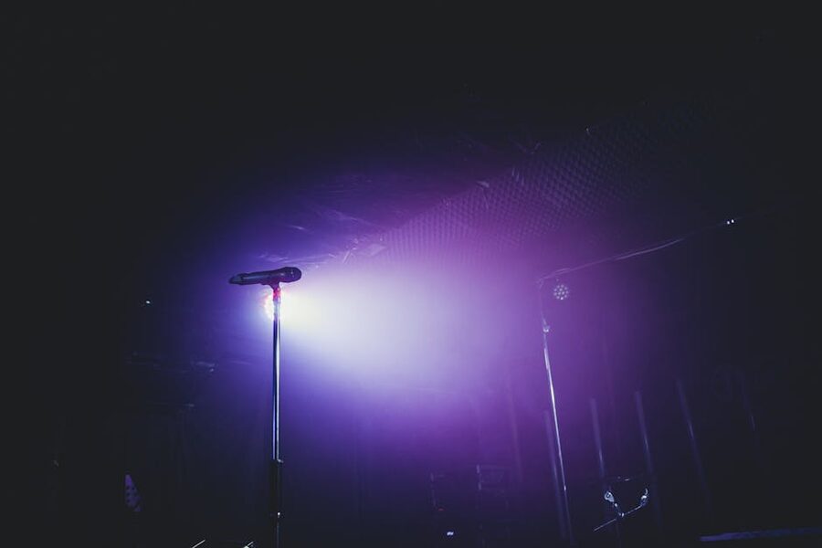 Microphone on stage with purple stage lighting
