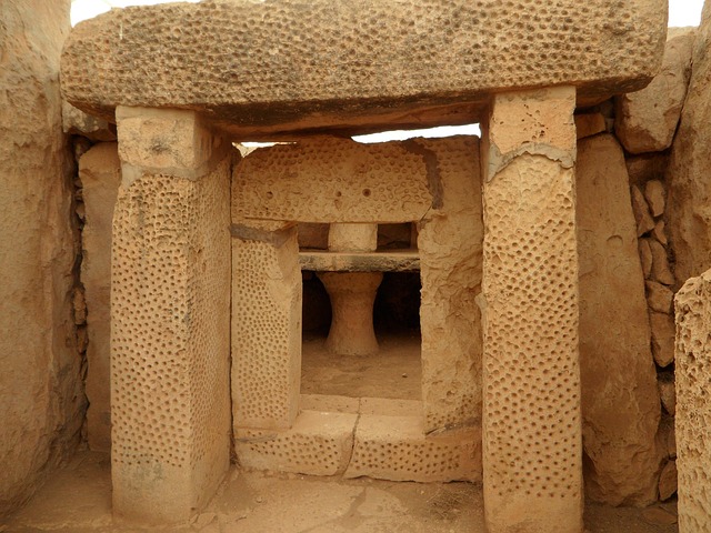 Decorated limestone doorway inside Mnajdra prehistoric temple in Malta