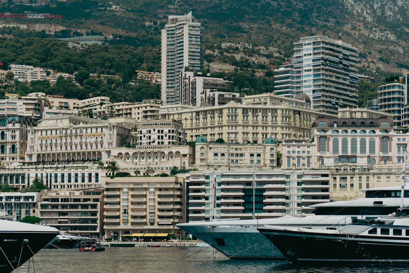 Monaco's harbor with luxury yachts and iconic architecture overlooking the Mediterranean