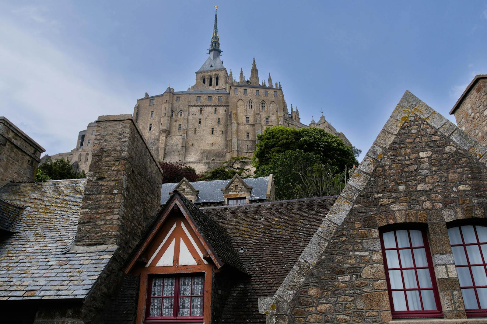 Mont Saint-Michel Abbey surrounded by historic stone village buildings