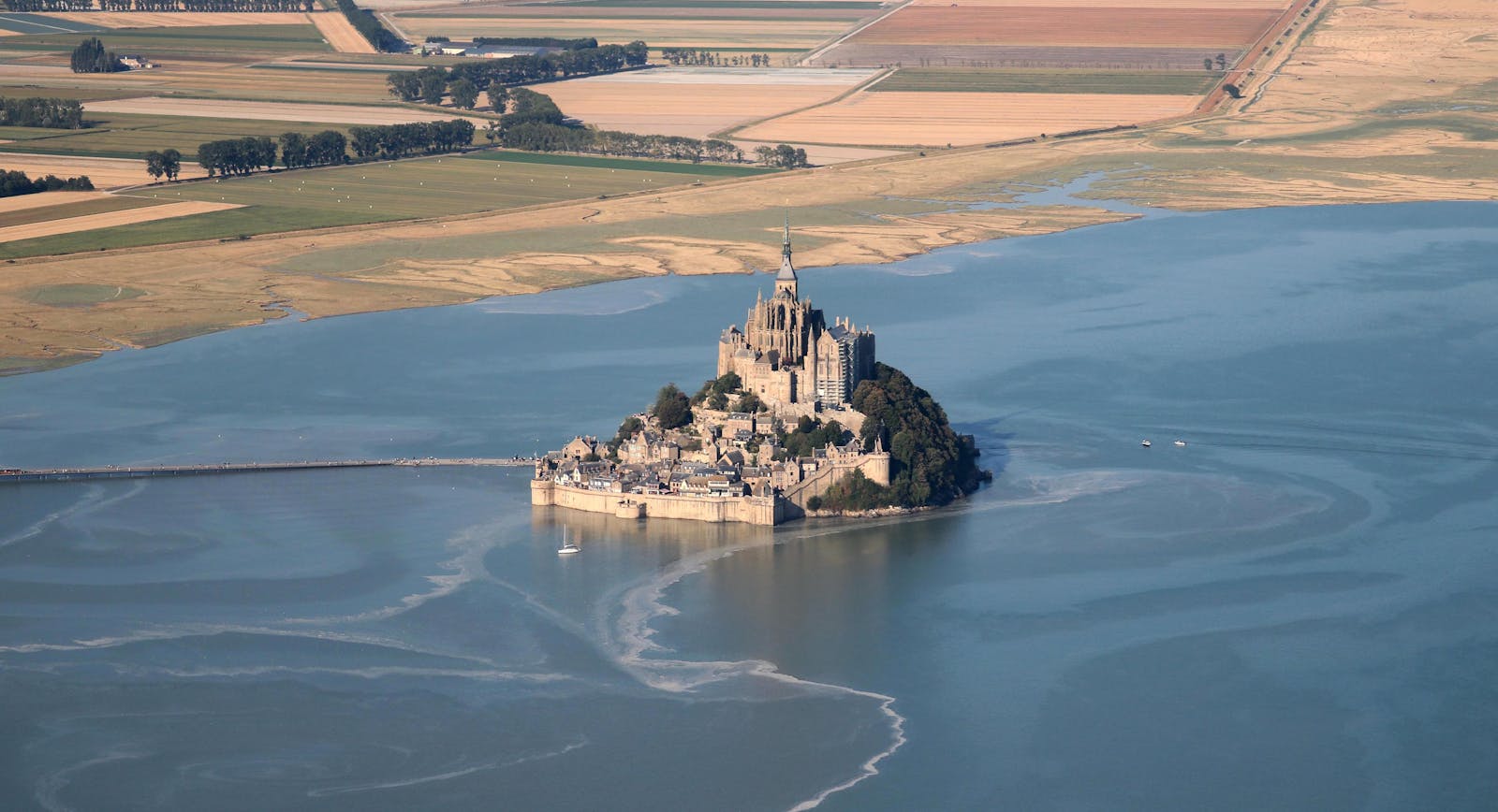 Aerial view of Mont Saint-Michel as a UNESCO World Heritage site in Normandie