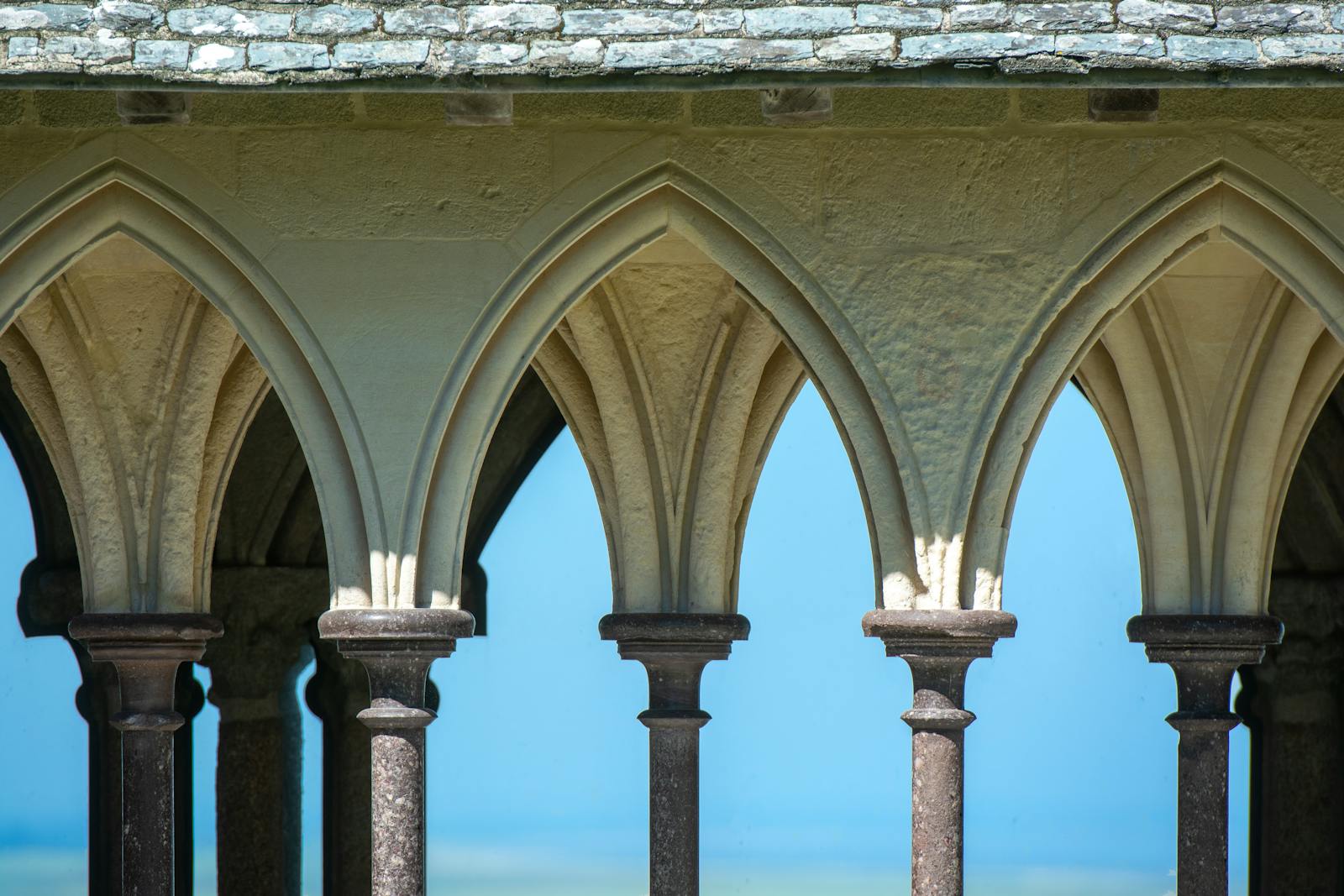 Gothic arches inside the Mont Saint-Michel Abbey