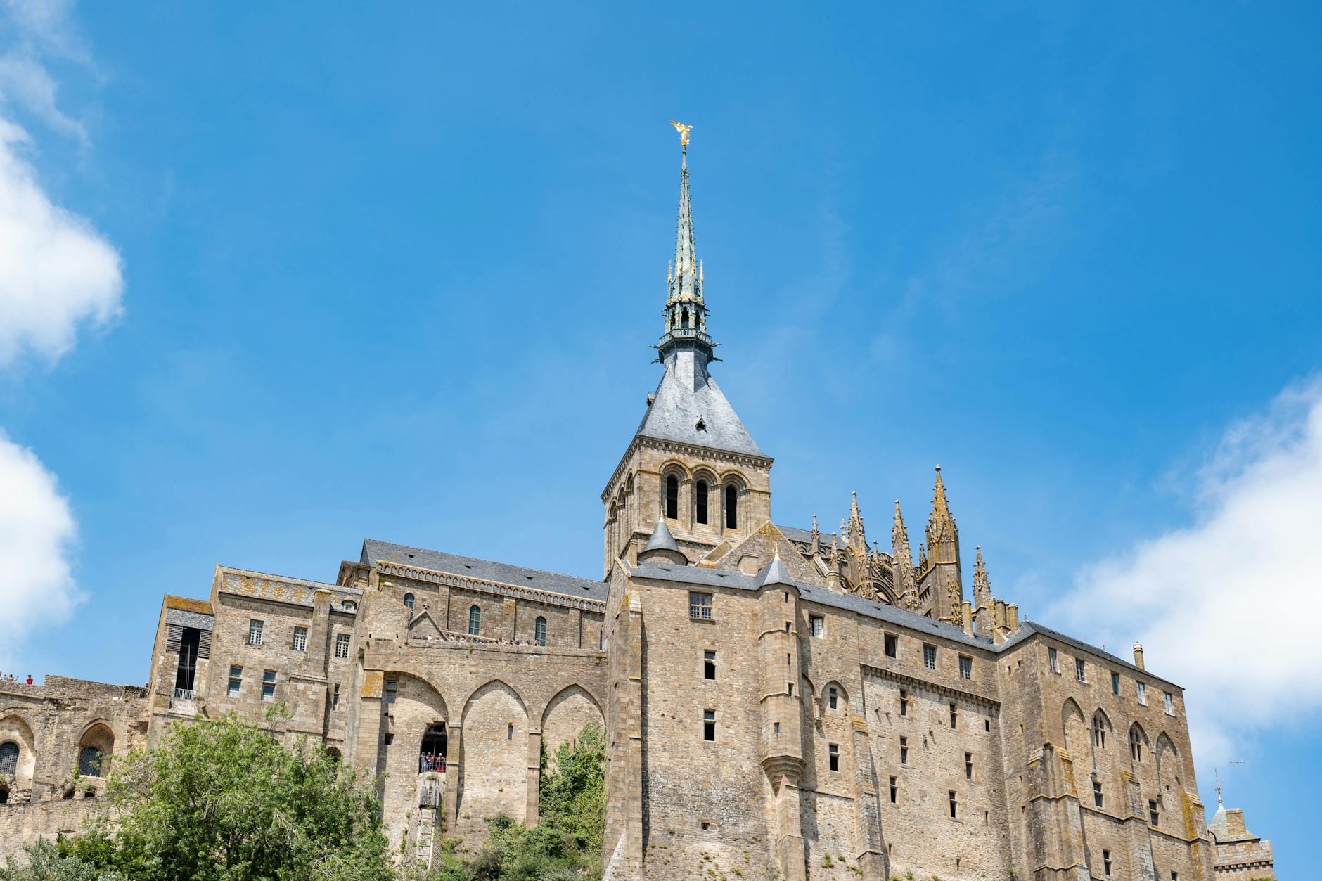 Majestic view of Mont Saint-Michel historic abbey with blue sky