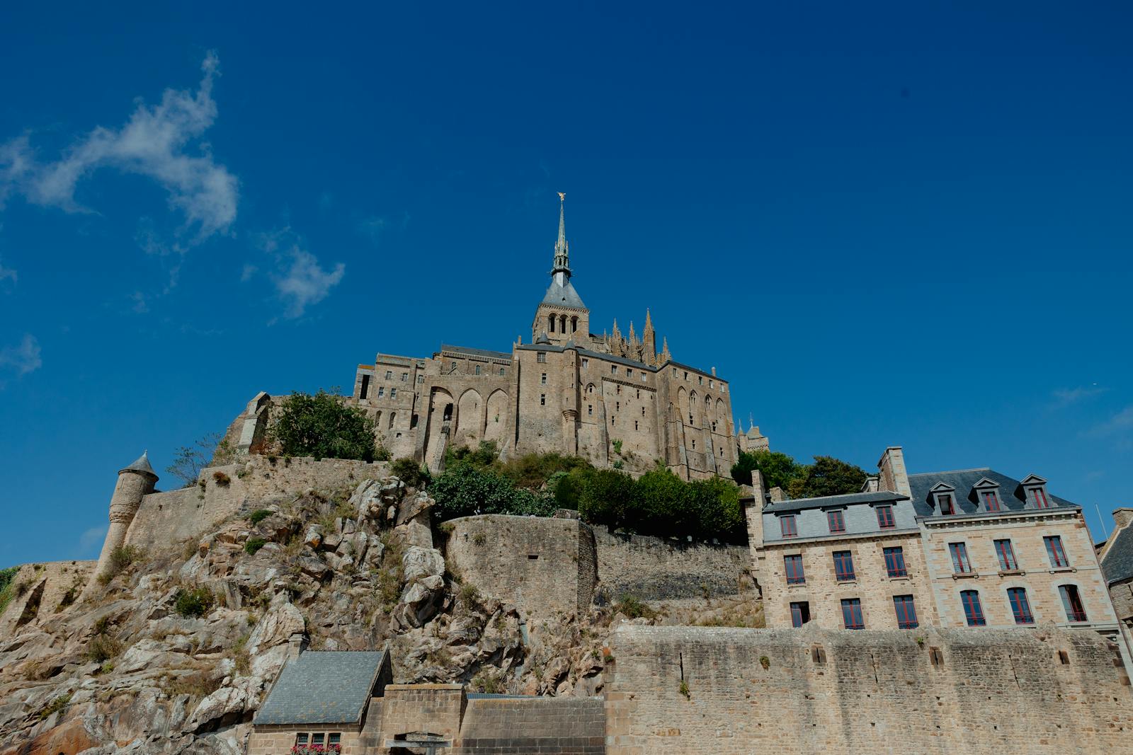 Mont Saint-Michel under a clear summer sky in Normandy