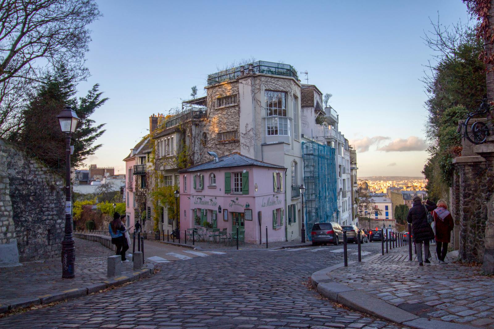 Beautiful cobblestone street with La Maison Rose in Montmartre Paris