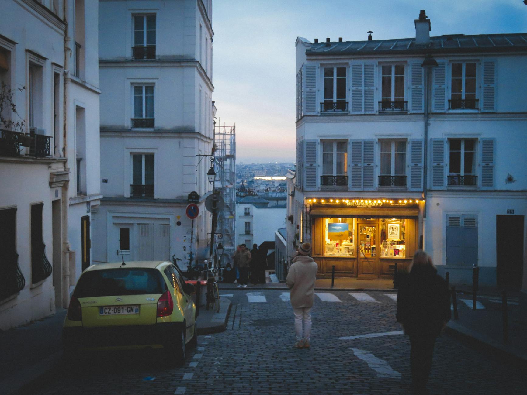 Evening scene on Montmartre streets with pedestrians