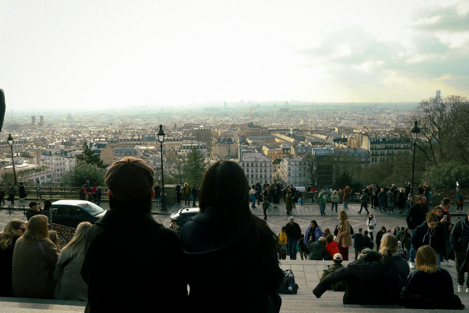 Paris cityscape seen from Montmartre with people enjoying the panorama