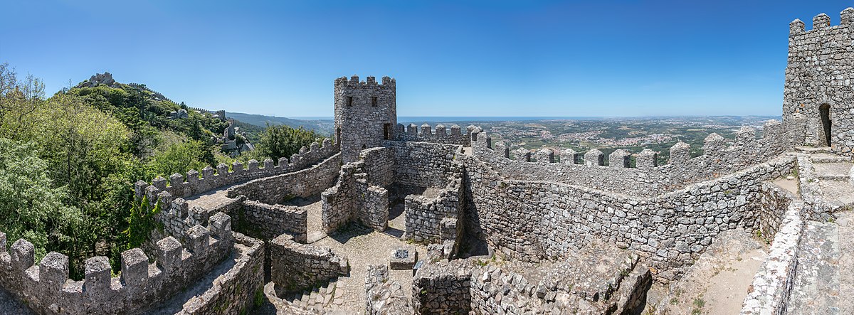 Panoramic view of Castle of the Moors walls stretching across Sintra hills