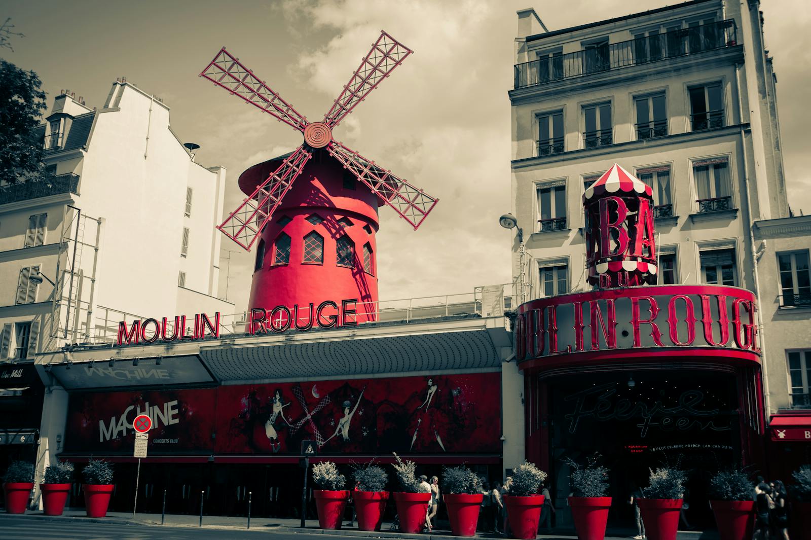 Iconic Moulin Rouge facade in Montmartre Paris with the famous red sign