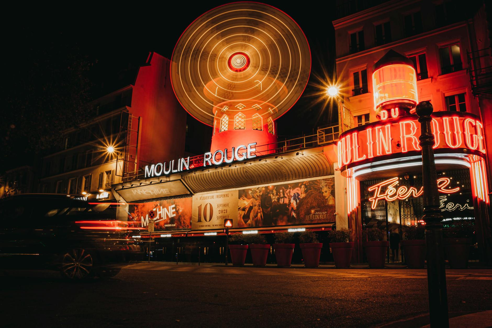 Moulin Rouge at night in Paris, France