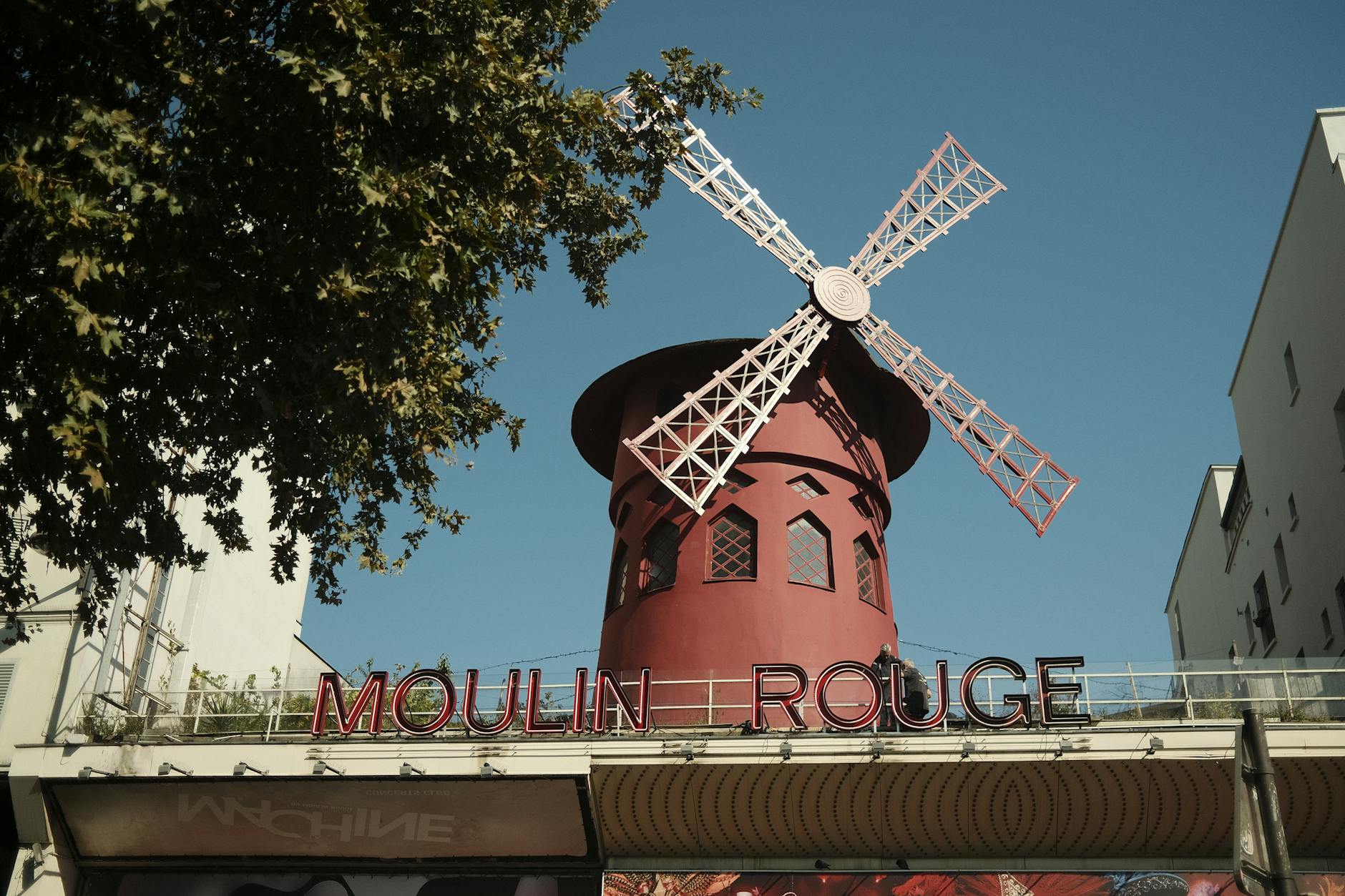 Moulin Rouge windmill against a clear blue sky in Paris