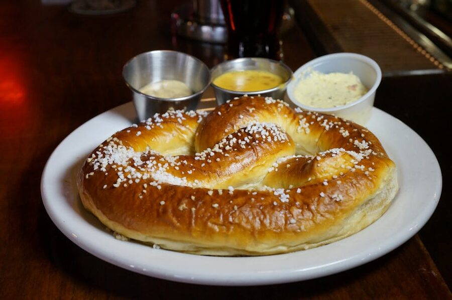 Warm Bavarian pretzel with mustard and cheese