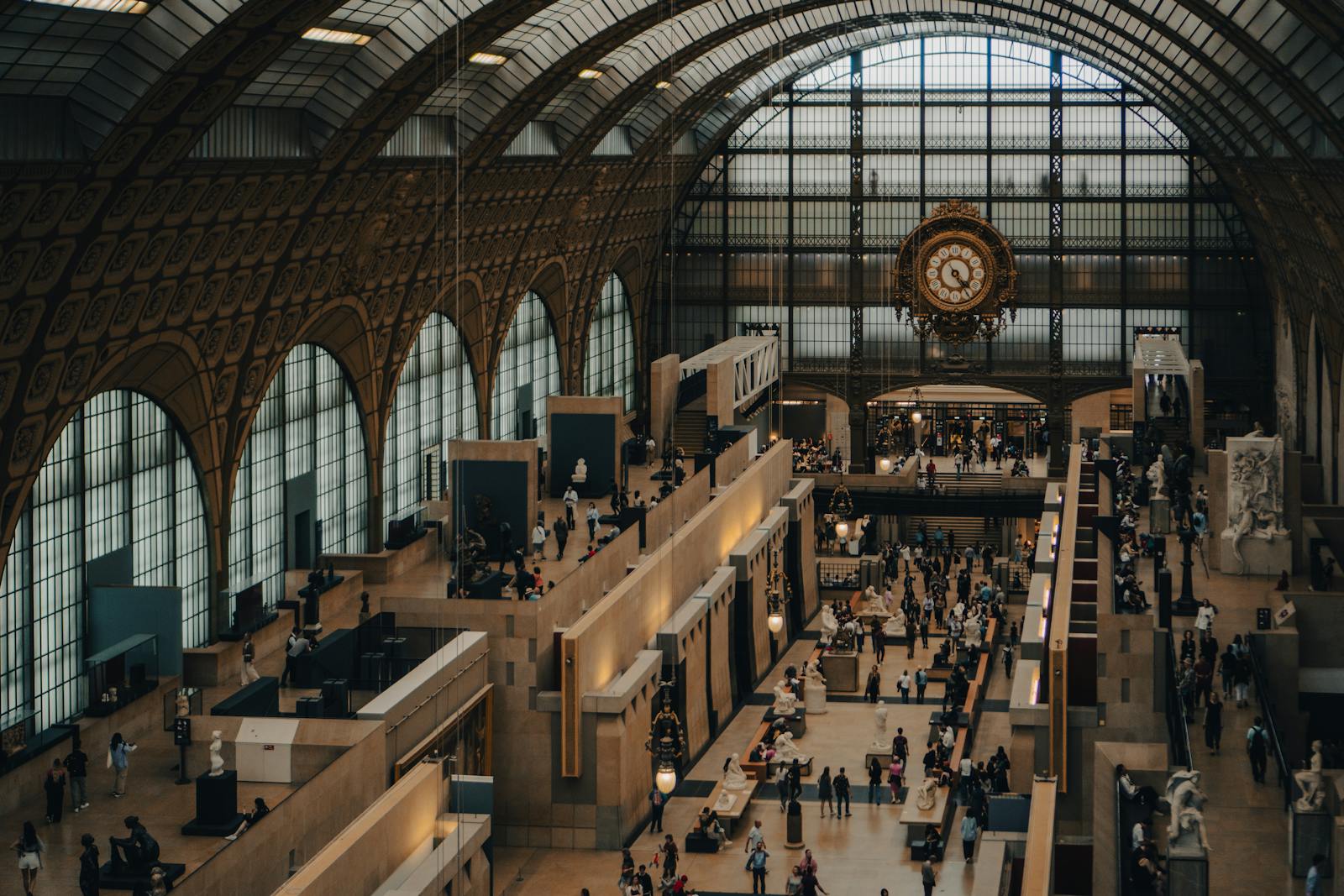 Visitors inside the Musée d'Orsay near the iconic clock face