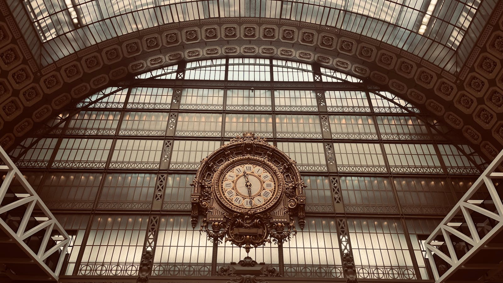 Vintage clock inside the Musée d'Orsay with intricate architectural details