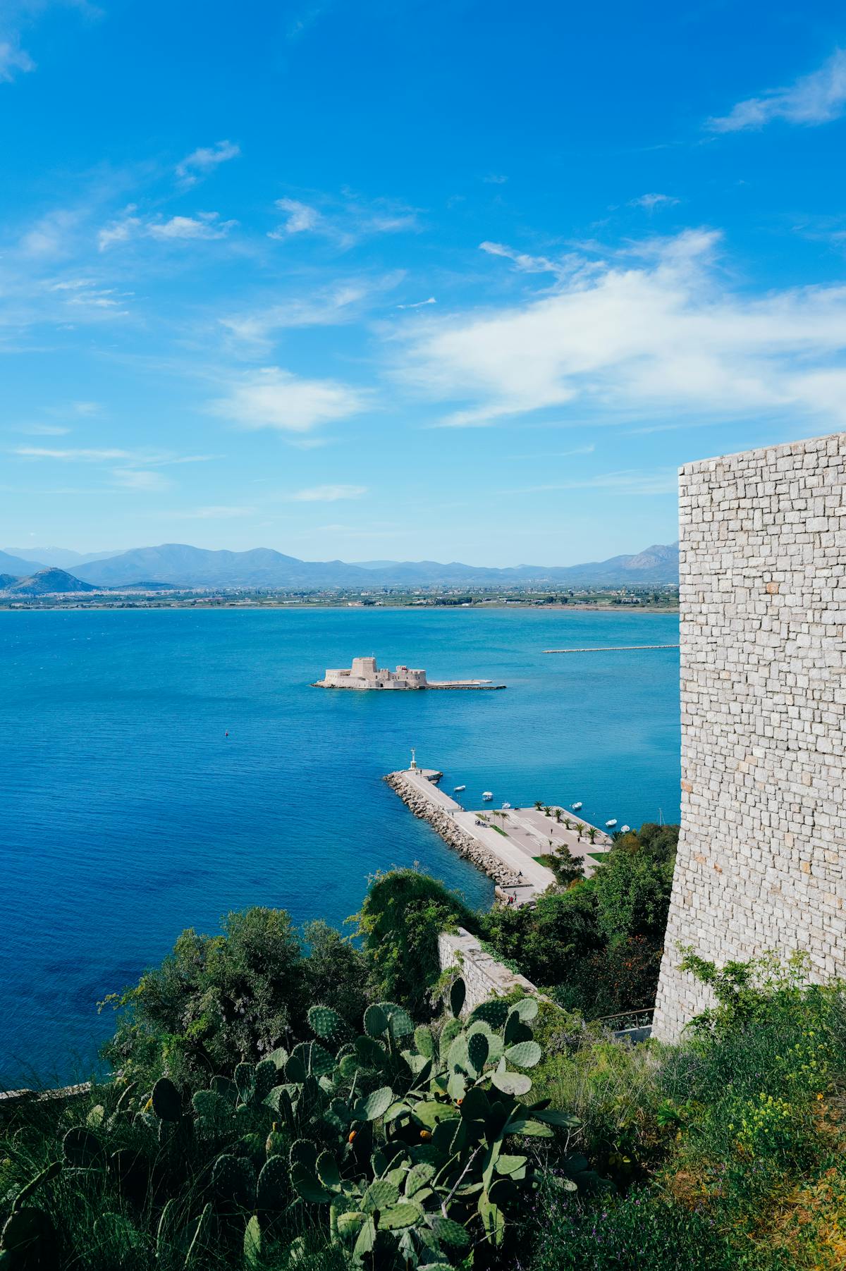 The picturesque harbor of Nafplio with the Bourtzi fortress visible on a small island