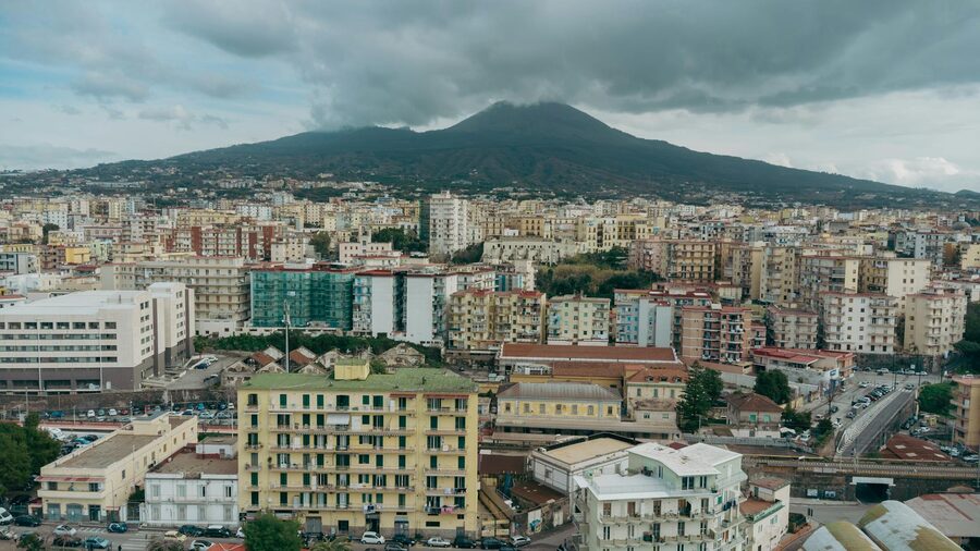 Aerial Naples cityscape with Mount Vesuvius