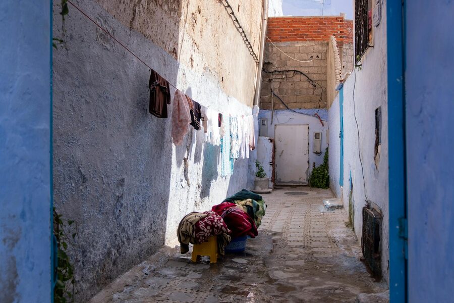 Sunlit alley in Naples with shadows