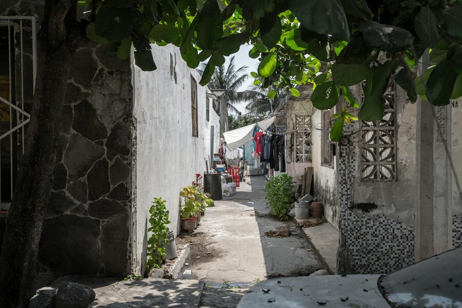 Narrow alley with sunlight and laundry