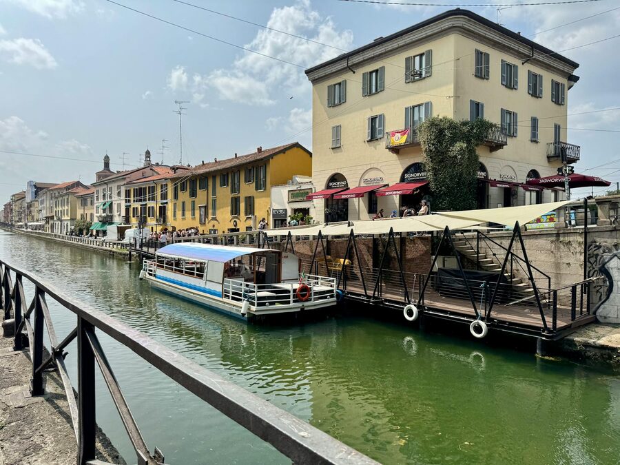 Navigli canal with boat and colorful buildings