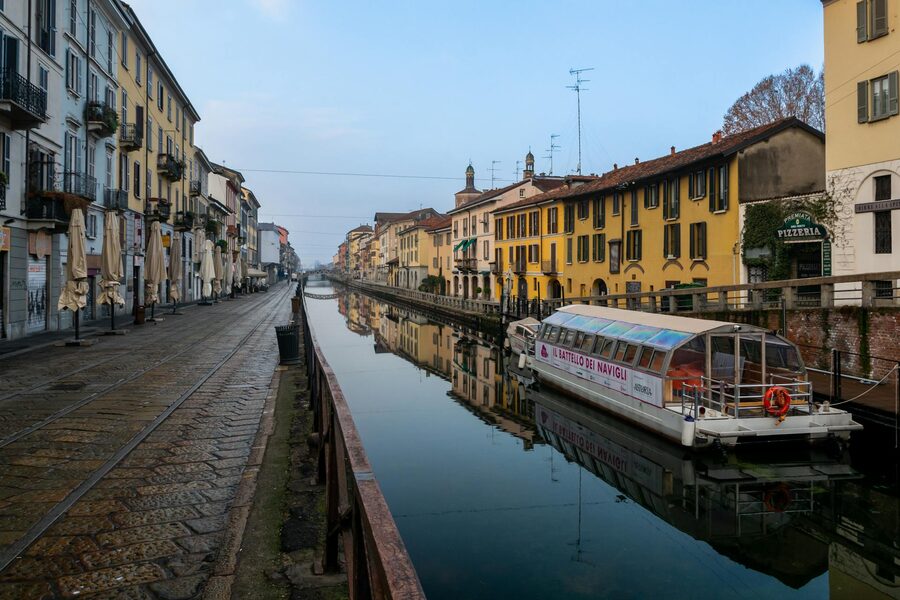 Navigli canal reflecting historic architecture in Milan